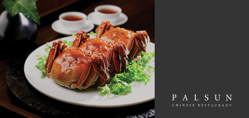  There are three pieces of steamed Shanghai crab and two cup of Chinese tea at the top.