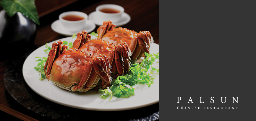 There are three pieces of steamed Shanghai crab and two cup of Chinese tea at the top.